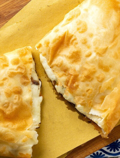 A tasty Sicilian fried pizza with tuma cheese and anchovies