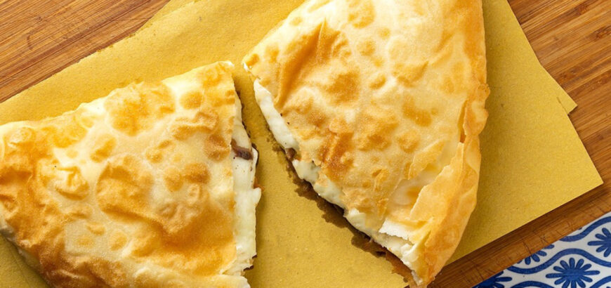 A tasty Sicilian fried pizza with tuma cheese and anchovies